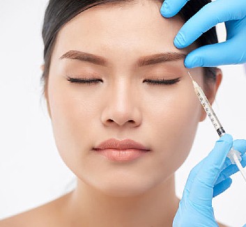 Botox injection in young woman's face